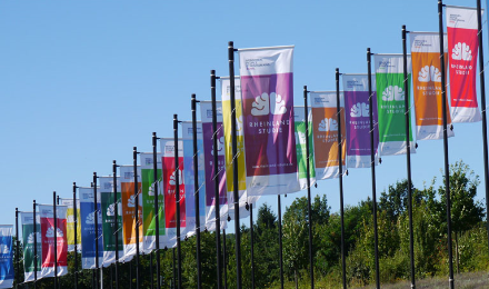 Flags printed with the logo of the Rhineland Study at the UN Square in Bonn